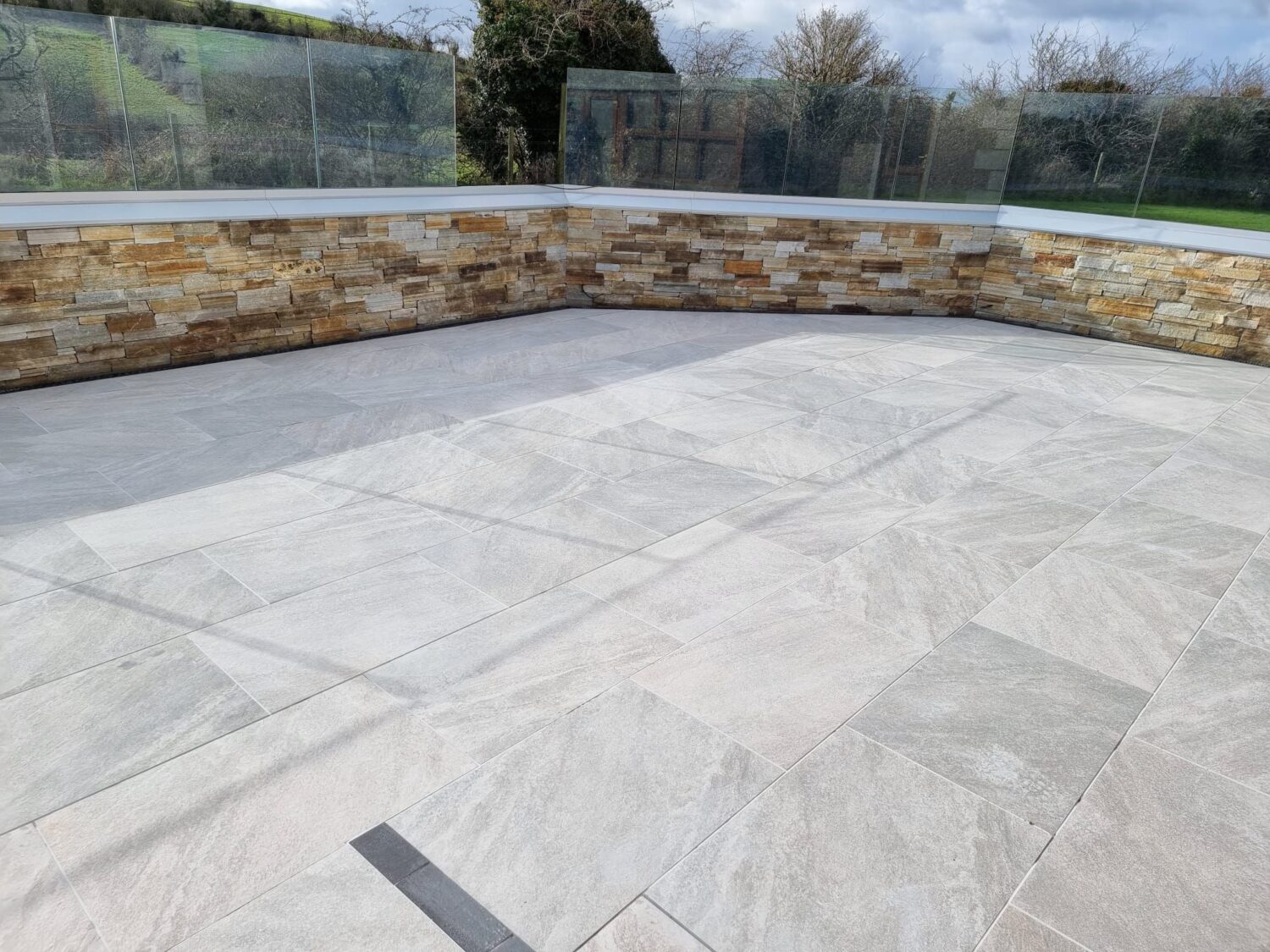 Stonehenge Grey Porcelain Tiles and Yellow Granite Cladding
